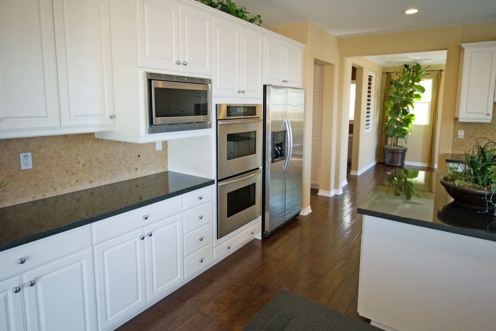 Kitchen with white cabinets and hardwood floor